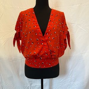 Sophisticated short sleeve top-gorgeous orange-red w/pops of black & white!